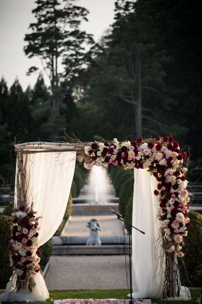 Kaitlyn & Thomas Wedding - Wedding Arch - Oheka Castle - Susan Stripling Photography