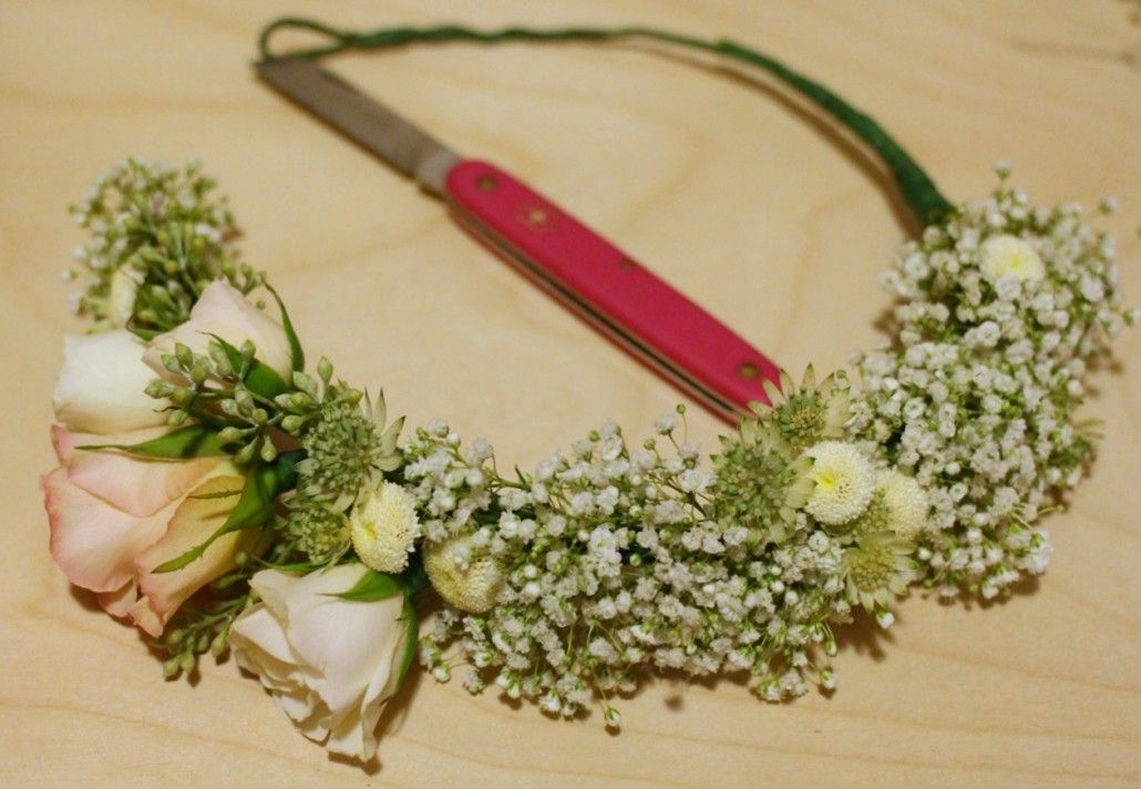 Carefully arrange stems against the floral-wire base, then tape to secure. 