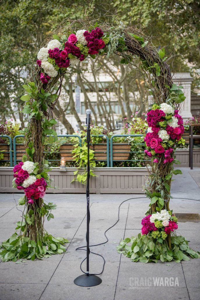 Floral Arch with Lush Greens, Hot Pink and Fuchsia Roses - Shelby and Jonathan NYC Wedding - Bryant Park Grill - Photo by Craig Warga Photography