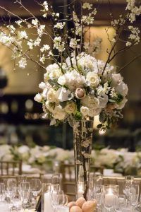 Joyce and Patrick – Le Parker Meridien – NYC Wedding - Tall Centerpiece, Branch Centerpiece - by Susan Stripling Photography – quince branches, peonies, hydrangea, tulips, phalaenopsis orchids, ranunculus - 335