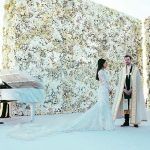 White Flower Wall at Kim Kardashian and Kanye West Wedding - photo by E! Online