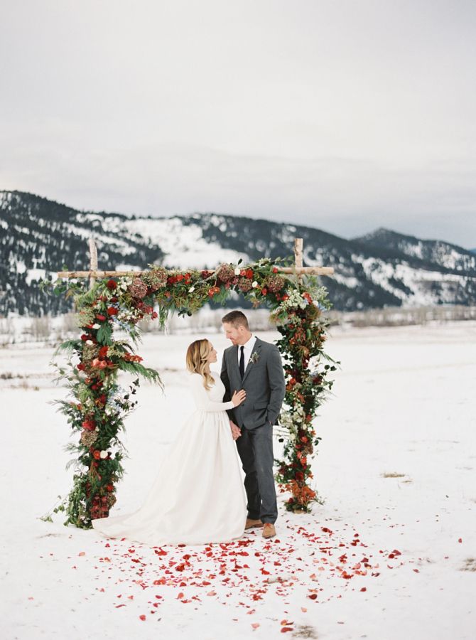 Winter Wedding Ceremony with Floral Arch - The Ranch at Rock Creek - Photo by Rebecca Hollis - via Style Me Pretty