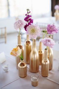 Gold Painted Bottles - Bud Vases - Photo by Sara and Rocky PHotography - The Wedding Chicks - Via Brit.co