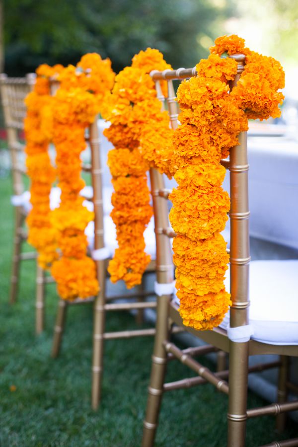 Indian Summer Outdoor Wedding - Marigold Chair Garland - via Style My Pretty - The Vault