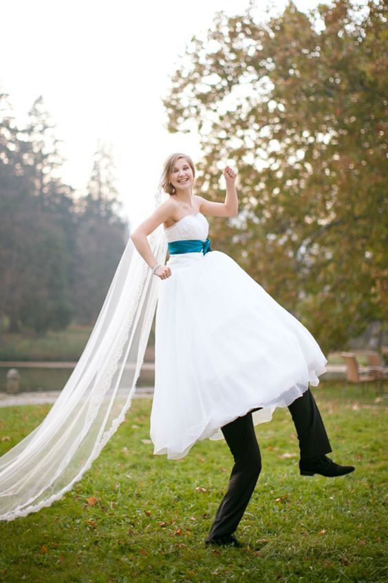 Bride on Grooms Shoulders - via elegantweddinginvites.com