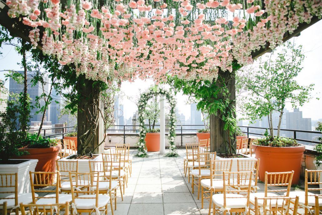 Mary & Galen Wedding - Hanging pink carnations and Ceremony Arch - The Hudson Hotel NYC - Photography by Jacqueline Pierson Weddings