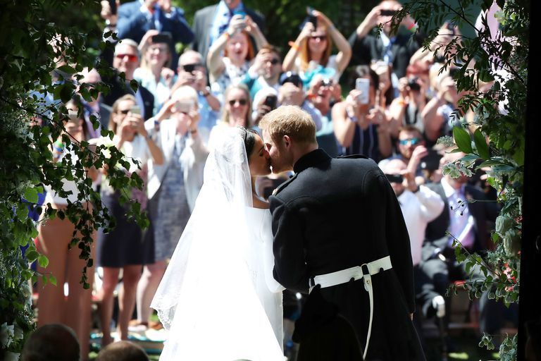 Meghan Markle and Prince Harry Royal Wedding Kiss - via elle.com